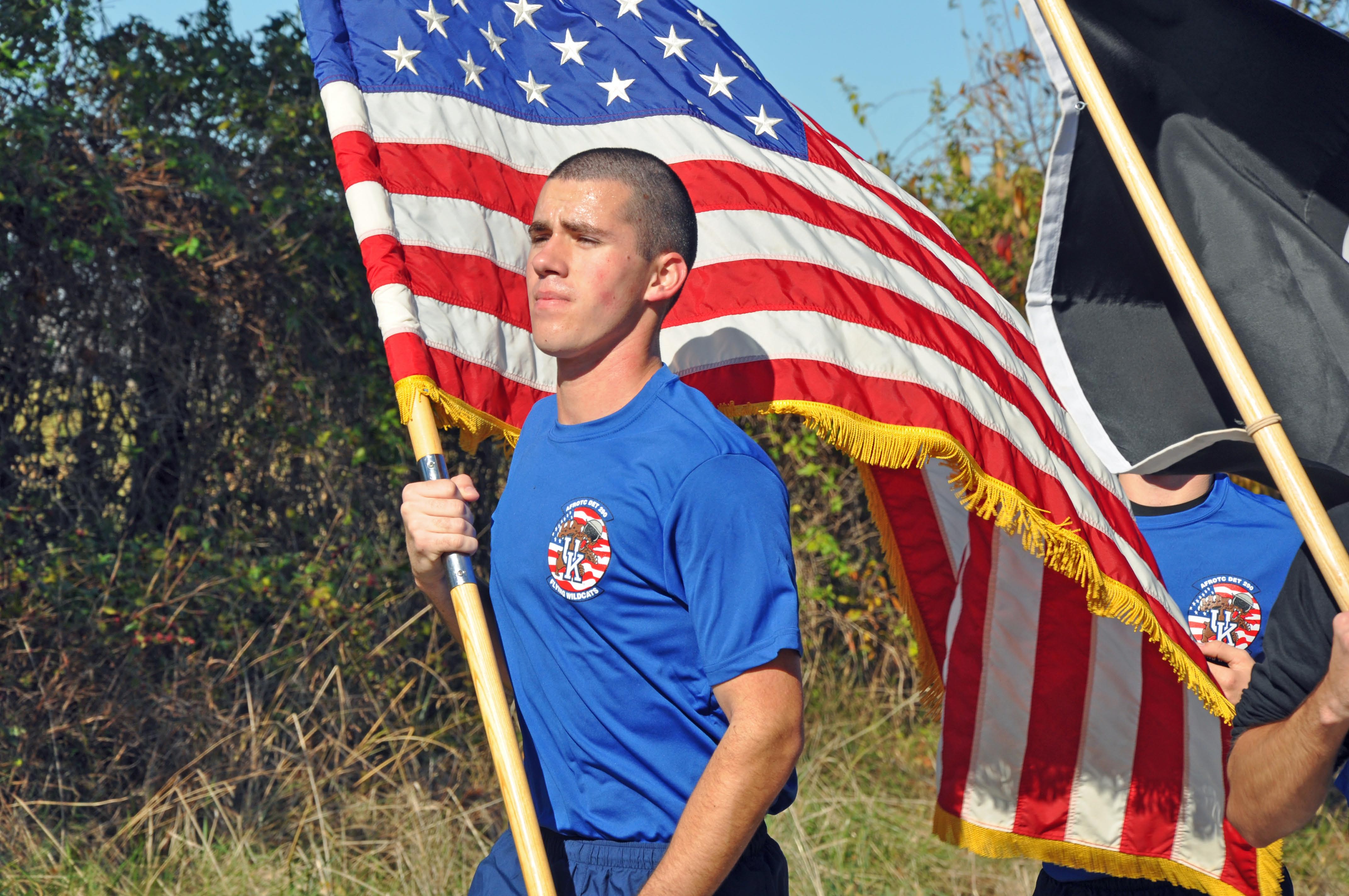 Cadet carries flag during a previous POW/MIA Run