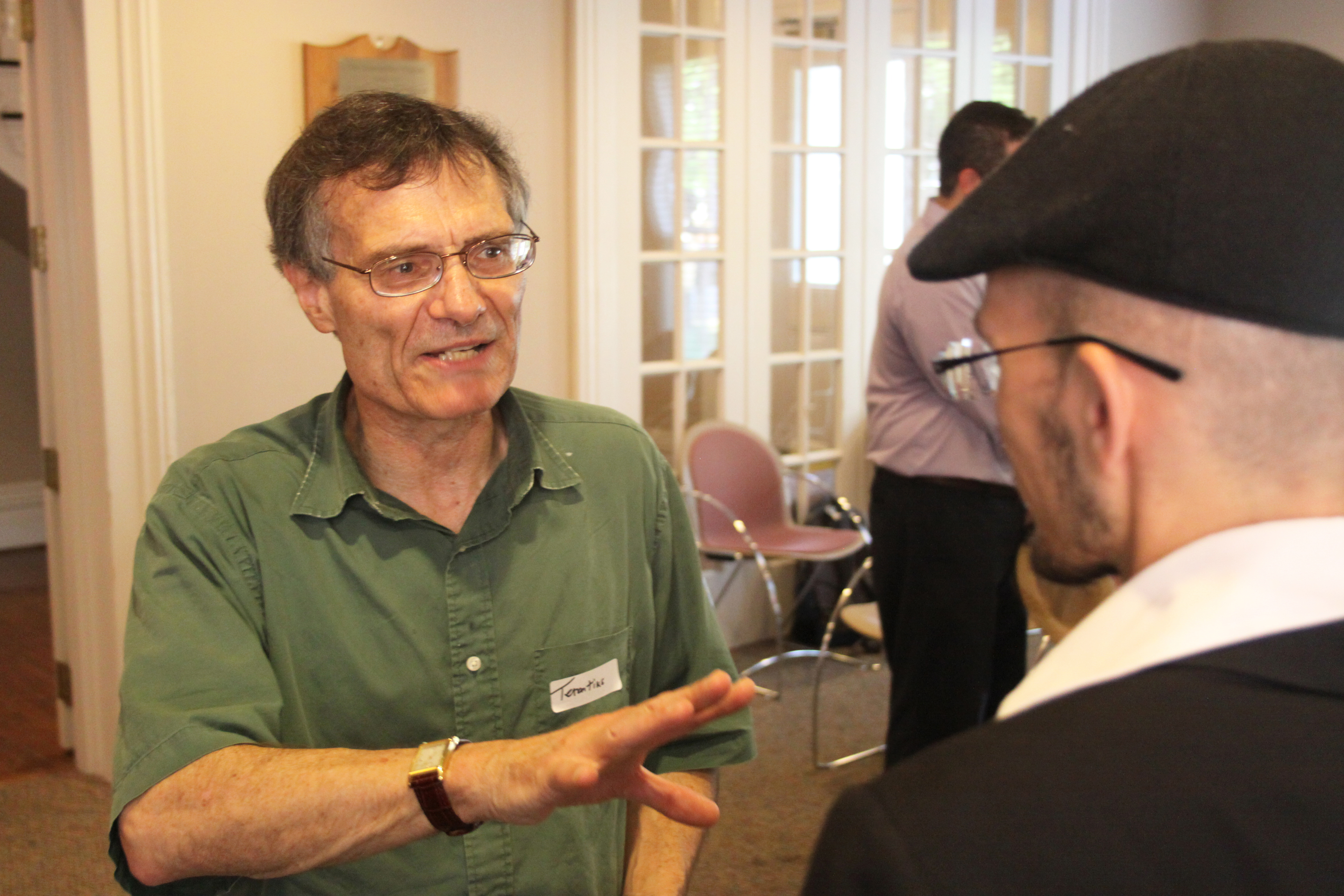 Terence Tunberg greets others at conference, in Latin, of course. Photo by Brian Manke