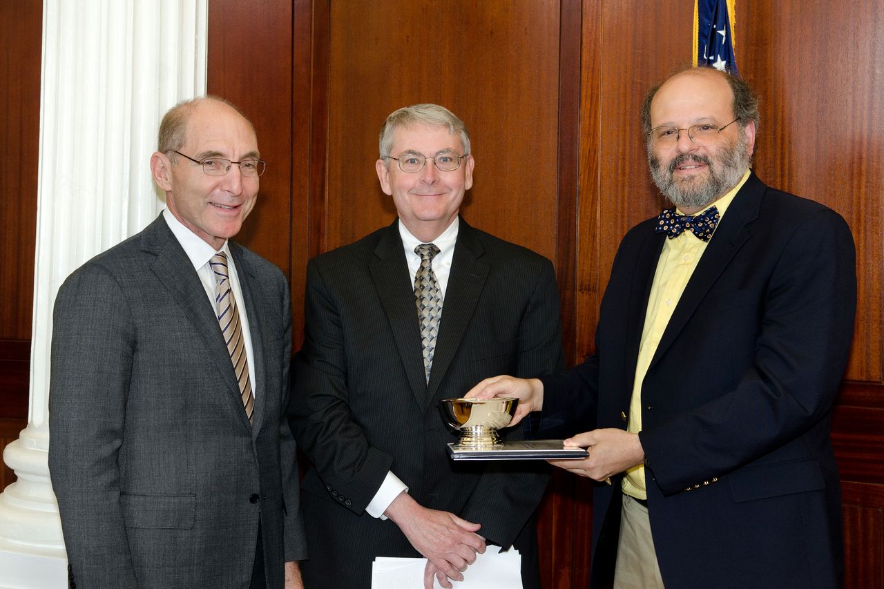 UK President Eli Capilouto and G.T. Lineberry, associate provost for faculty advancement, present the 2013 Albert D. and Elizabeth H. Kirwan Memorial Prize to Sidney W. Whiteheart, professor of molecular and cellular biochemistry in the UK College of Medicine. 